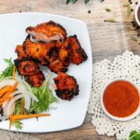 Chicken Tikka · Boneless chicken marinated in herbs and spices, barbecued over charcoal. Cooked with cream a...