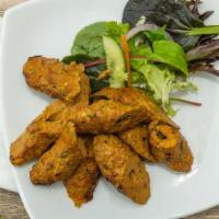 Chicken Seek Kabab · Marinated ground chicken cooked with clay oven.