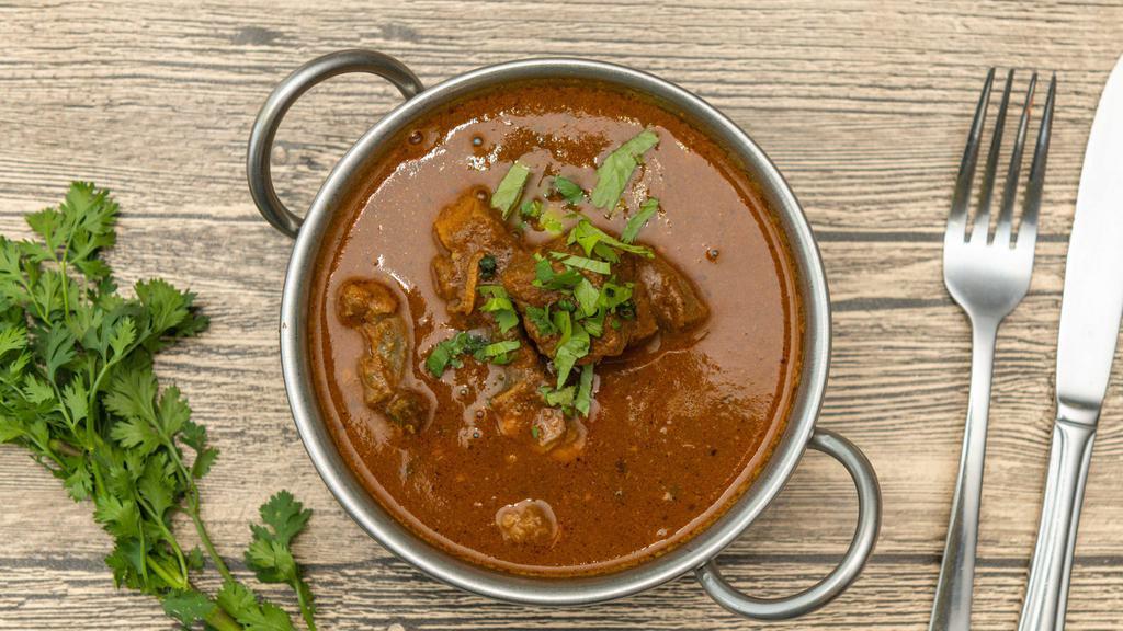 Garlic Curry · Meat cooked with fresh garlic with curry sauce.