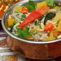Kashmir Pulao · Basmati rice, grained with natural fragrances cooked with fruits and nuts.