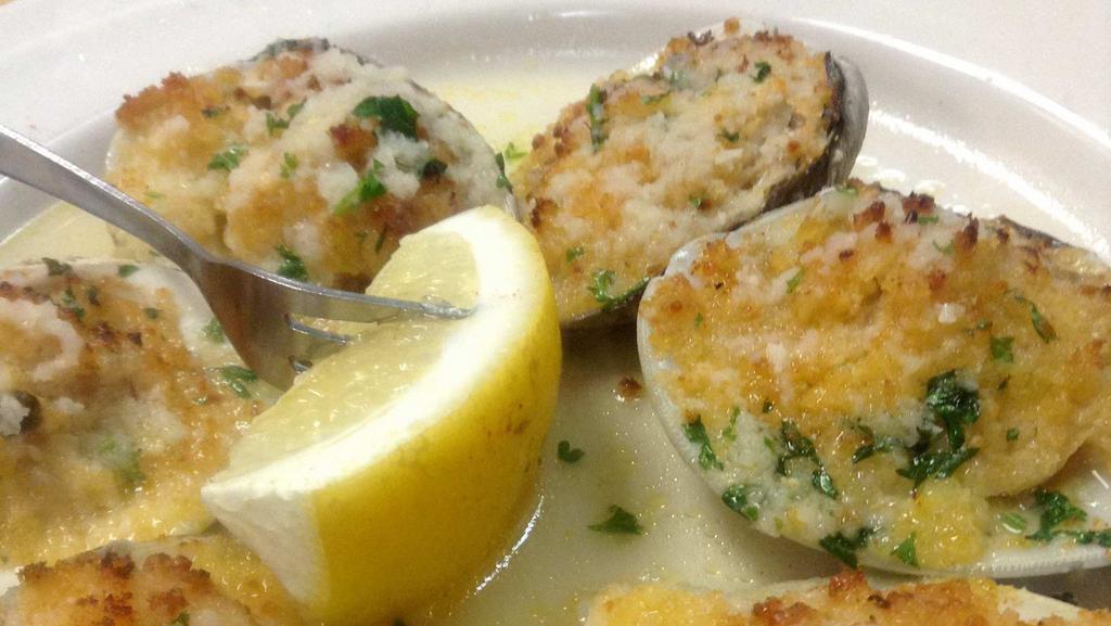 Clams Oreganata · (6) Baked clams topped with bread crumbs, parsley, oregano served with white wine – lemon sauce.