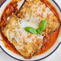 Eggplant Rollatini · Thinly sliced, par-baked eggplant slabs rolled up with a delicious ricotta mixture, baked wi...