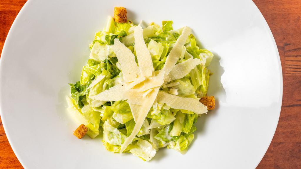 Caesar Salad · Hearts of romaine, aged parmigiana, toasted croutons, housemade caesar dressing.