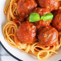 Spaghetti Con Polpette · Spaghetti with our famous beef meatballs in tomato sauce