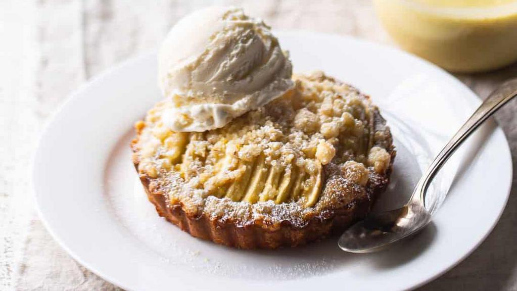 Apple Tartlet · Thin crisp pastry shell filled with sliced apples served with vanilla ice cream.