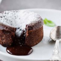 Chocolate Souffle · Moist chocolate cake with a heart of creamy rich chocolate served with vanilla ice cream.