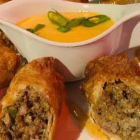 Philly Cheesesteak Eggrolls · Crisp wonton filled with seasoned beef, bell peppers, onions and sharp cheese finished with ...