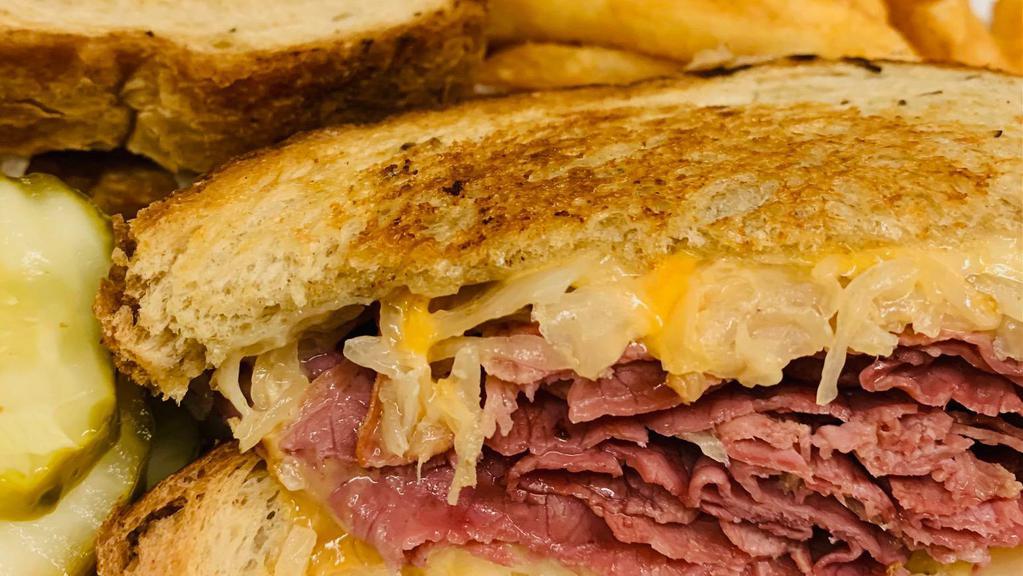 Reuben · A classic Reuben with sliced corned beef, sauerkraut, Swiss, and thousand island dressing. Served on rye bread.