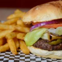Deluxe Burger · Half-pound seasoned beef served with lettuce, tomato, onion, and pickles.