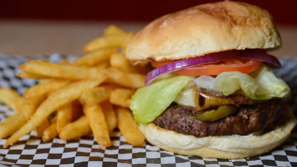 Deluxe Burger · Half-pound seasoned beef served with lettuce, tomato, onion, and pickles.