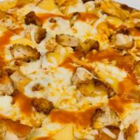 Buffalo Chicken Wing Pizza · Spicy buffalo sauce, fried chicken breast, smoked Gouda and mozzarella. Served with creamy b...