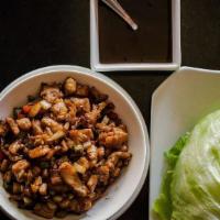 Chicken Lettuce Wraps · Finely diced chicken and vegetables wrapped in fresh lettuce cups.