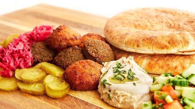 Falafel Plate · Hummus, Tahini, Israeli Salad, Pickles and Pickled Cabbage, Served with a Pita.