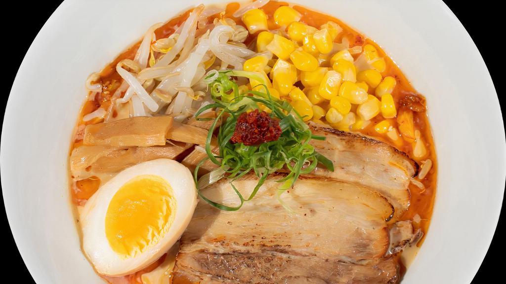 Tonkotsu Spicy Miso · All natural pork bone broth (tonkotsu) flavored with our house-made bean paste (miso)  and house-made spicy sauce.. Thin noodles topped with Onoya egg, seared pork belly charsiu, beansprouts, menma, corn, and green onion.
