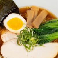 Shoyu Ramen · Authentic light chicken broth flavored with our house-made soy sauce (shoyu).. Yellow thin n...