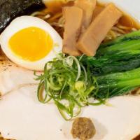 Yuzu Ramen · Authentic light chicken broth flavored with with the choice of our house-made soy sauce or s...