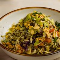 Tea Leaf Salad [V] [Gf] · Fermented Burmese tea leaves with tomato, cabbage, peanuts, fried beans and seeds, lime juic...