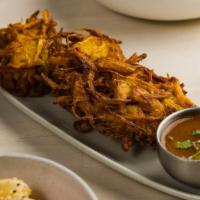 Onion Fritters [V] [Gf] · Onion Fritters with Tamarind-Garlic dip.

Vegan and gluten free