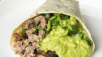 Suadero Taco · Two soft corn tortillas served with guacamole, onions & cilantro.