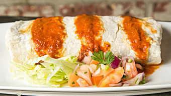 Chicken Chipotle Burrito · Chicken Chipotle, Monterey Jack cheese, sour cream, rice, & beans; served with lettuce and p...