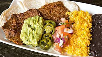 Carne Asada · Grilled beef steak served with onions, guacamole, pico de gallo, jalapenos, (3) flour tortil...