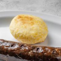 Morcilla Con Arepa · Blood sausage with traditional white corn biscuit.