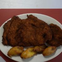 Chuleta De Pollo Empanizada · Servido con maduros. / Breaded fried chicken cutlet served with sweet plantains, rice, beans...