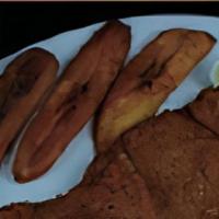 Chuleta Empanizada · Servido con maduros. / Breaded fried pork loin cutlet served with sweet plantains, rice, bea...