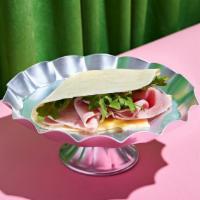 Ham And Swiss Crepe · Savory cured ham with melty swiss and mixed greens wrapped in a warm crepe.