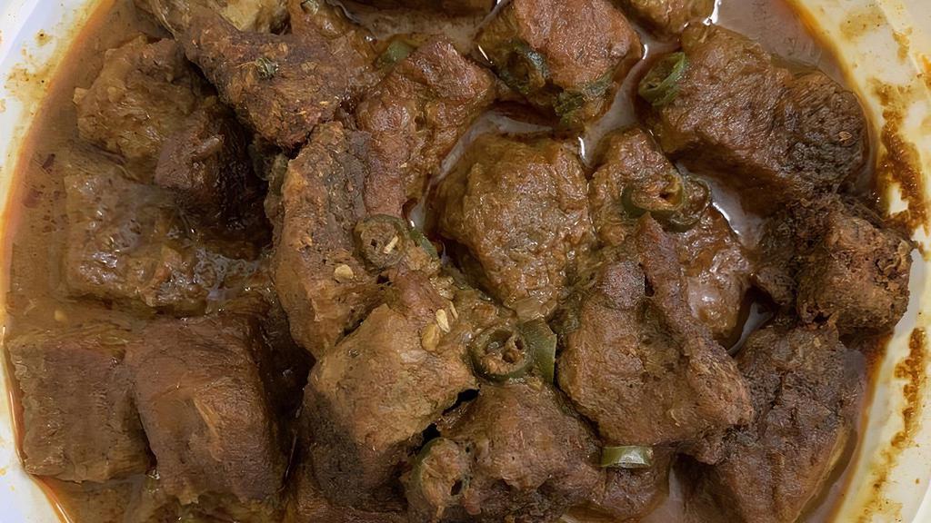 Beef Rendang · Hot and spicy. Tender beef braised in a thick spicy curry sauce with coconut milk and lime leaf.