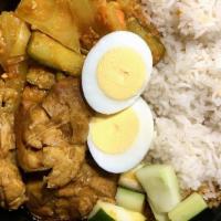 Nasi Lemak · Hot and spicy. Coconut rice flavored with cloves and screwpine leaves. Served with pickled v...