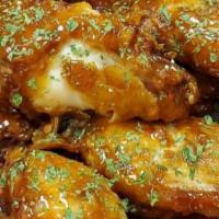 Chicken Wings · Fried chicken wings with choice of buffalo, BBQ, thunder or sweet chili sauce.