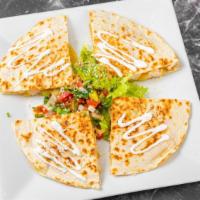 Quesadilla · Flour tortilla, melted cheese, sour cream, guacamole and pico de gallo. Choice: chicken, ste...