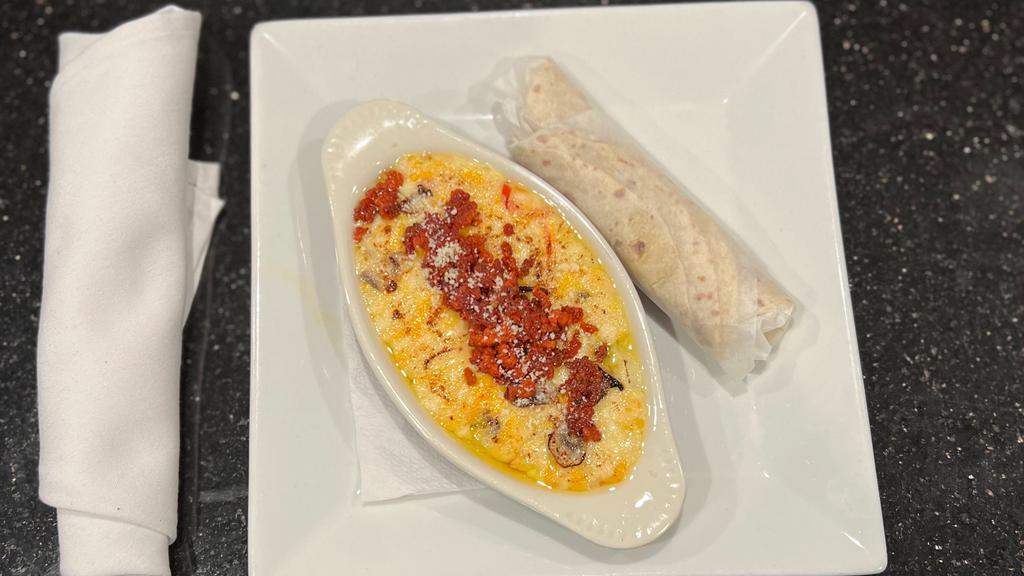 Queso Fundido · Melted with our secret 3-mix cheeses, chorizo and onion. Served with flour tortillas.