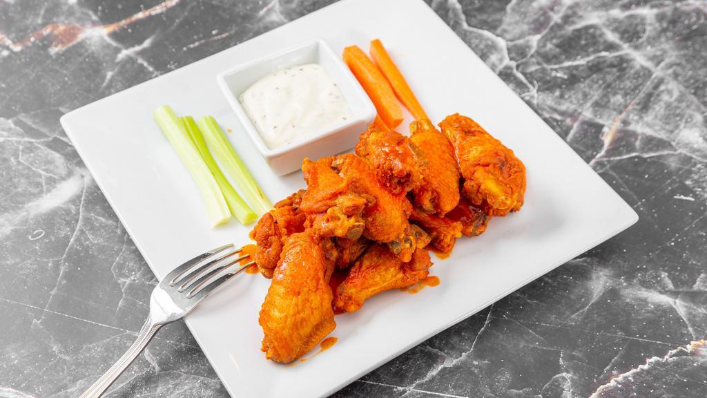 Chicken Wings · Crispy chicken wings accompanied with carrots, celery and ranch dressing. Simmered in your choice of BBQ, Buffalo or chipotle sauce.
