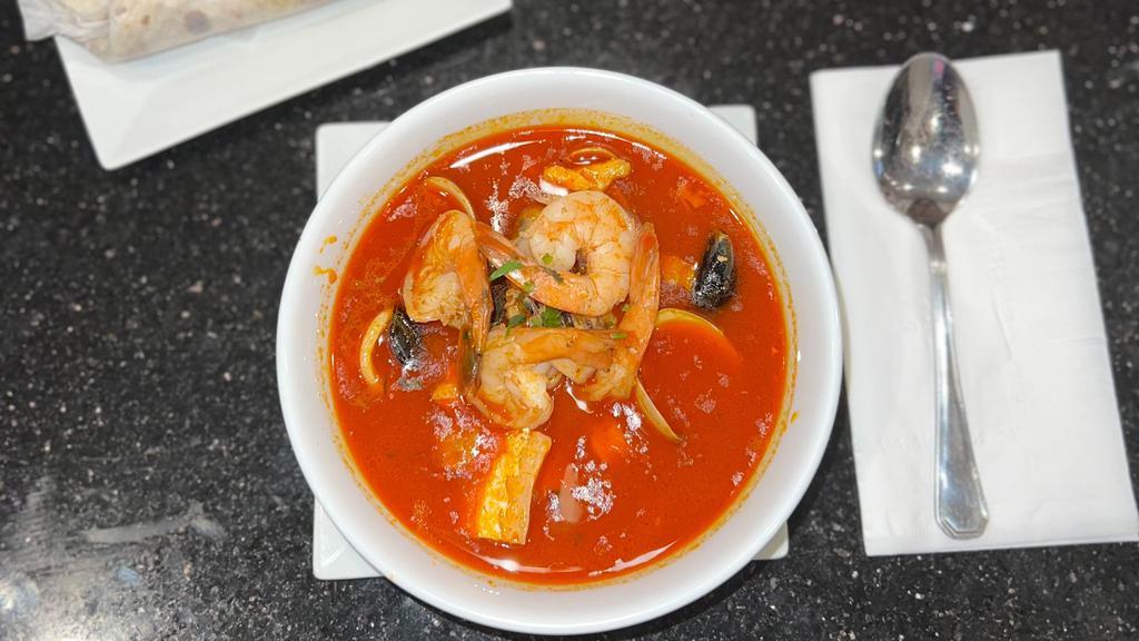 Seafood Soup · A combination of shrimp, mussels, salmon and clams in a rich flavorful broth.