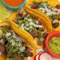 Carnitas Tacos · 3 soft shell tacos served with Onion, Cilantro, Guacamole, Pico de Gallo & Mexican salsa.