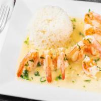 Camarones Al Ajillo · Jumbo shrimp cooked with butter, garlic, white wine and garnished with cilantro.