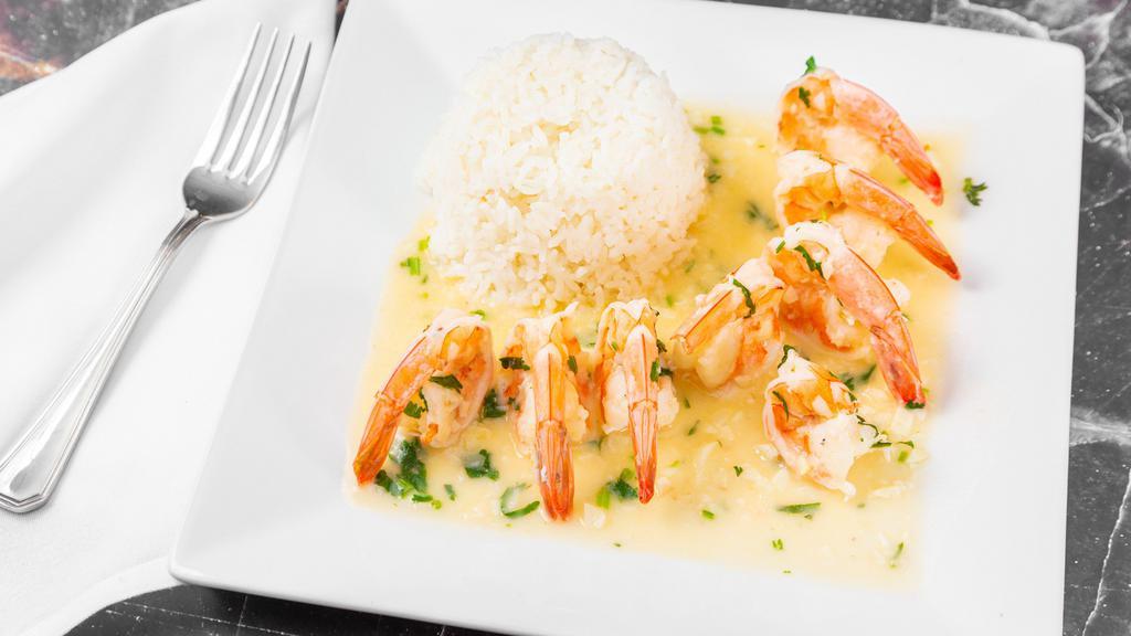 Camarones Al Ajillo · Jumbo shrimp cooked with butter, garlic, white wine and garnished with cilantro.