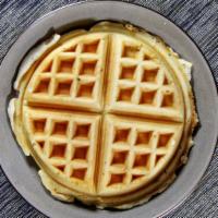 Golden Brown Belgian Waffle · Served with butter and syrup.