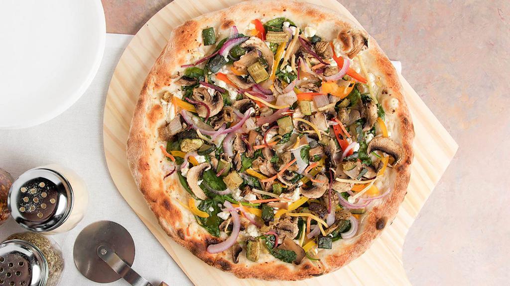 Veggie Delight · Olive oil and garlic sauce, Feta and Ricotta cheese, bell peppers, red onion, mushroom, spinach, roasted zucchini.