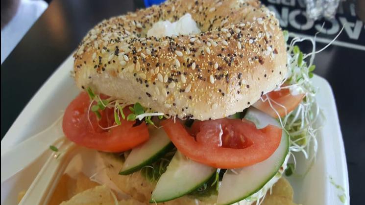Sprout Bagel · Vegetarian. Toasted everything bagel with avocado, Cream cheese, clover sprouts, tomato, and cucumbers.
