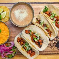 Street Tacos · California street tacos served with cilantro and onions. Choice of: Carnitas, Steak, Chicken...