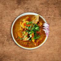 United Goat Curry · Tender goat meat cooked slowly  with tomatoes, onions, fresh herbs and Indian spices.