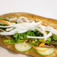 Pork Banh Mi · Mayonnaise, jalapeno, marinated roasted pork, ham, fresh cucumbers, daikon and pickled carro...