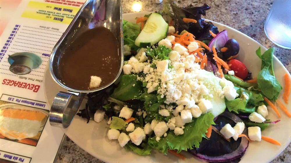 Special Greek Salad · Anchovies, lettuce, tomato, cucumbers, olives and feta cheese.