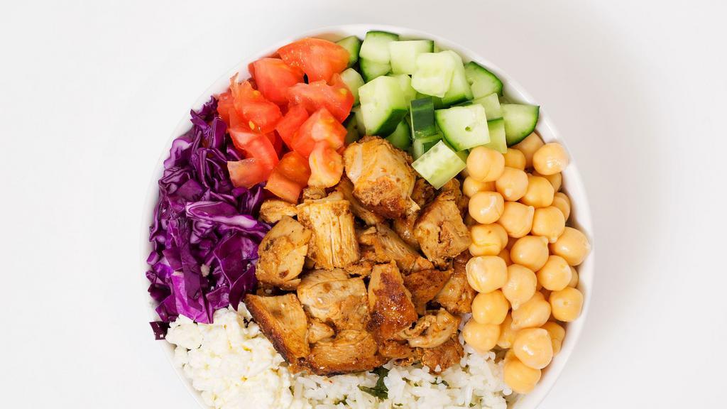 Mediterranean Bowl · Your choice of rice and protein served with shredded cabbage, feta cheese, diced tomato and cucumber, chickpeas, and a side of tahini.