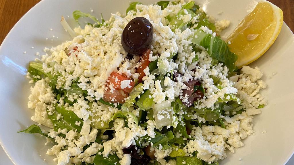 Mediterranean Salad / Akdeniz Salatasi · Fresh tomatoes, lettuce, green peppers, kirby topped with feta cheese, olive oil and lemon juice.