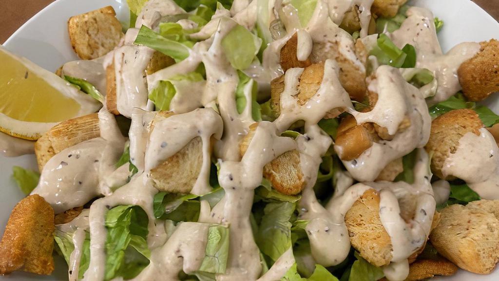 Caesar Salad · Romaine lettuce and croutons dressed with parmesan cheese & caesar dressing.