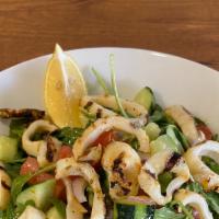 Calamari Salad · Arugula, kirby, tomato, onion, lemon juice and olive oil topped with grilled calamari.